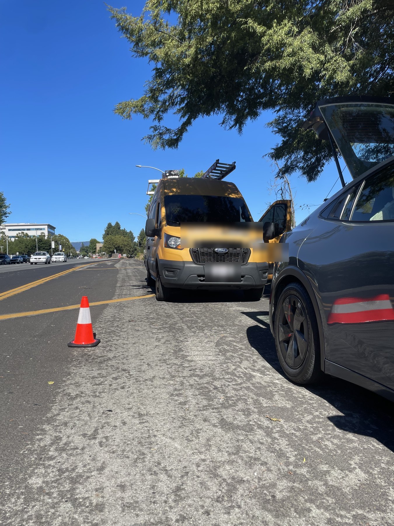 A contractor's work van at the roadside during a mobile tire service call